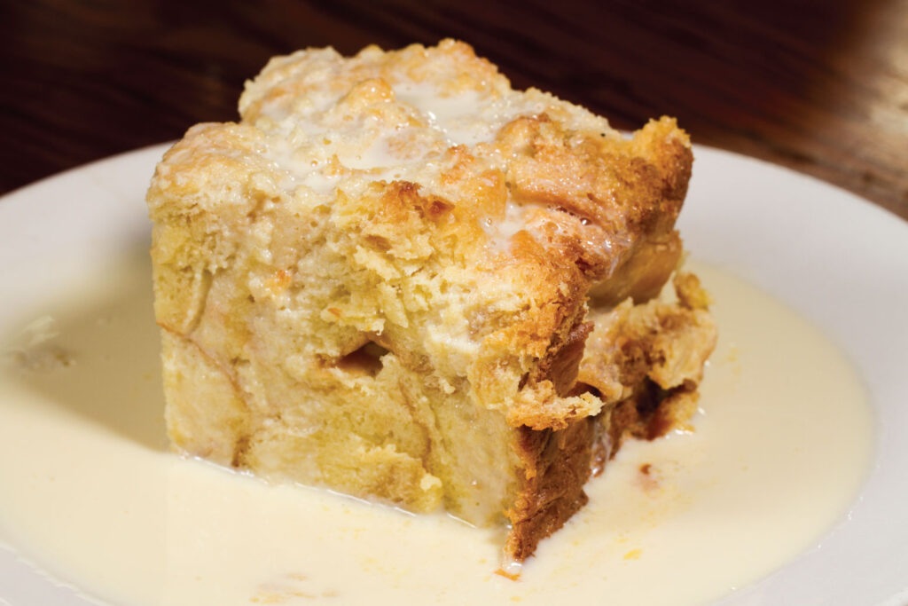 Bread pudding served with a creamy sauce